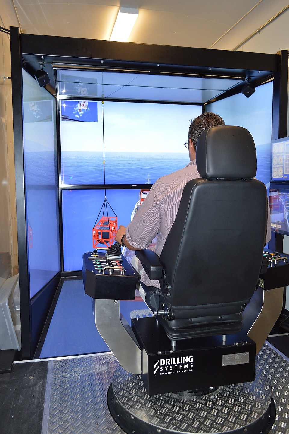 A man in a simulator at Robert Training and Conference Center